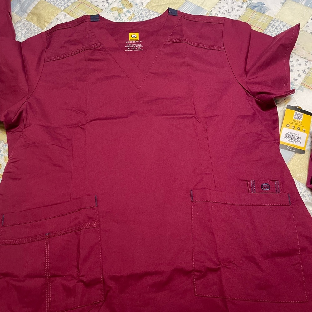 Wonderwink Wonderflex women’s scrubs.  Wine in color and is size XL